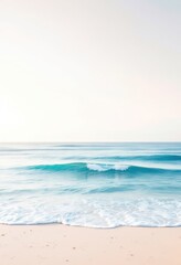 Fototapeta premium Calm ocean wave on sandy beach. Serene seascape for relaxation, meditation, and summer vacation themes. Perfect for travel brochures and holiday cards.