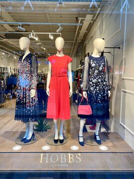 Bracknell, England - January 23, 2025: Window display of mannequins wearing Spring fashions at a Hobbs of London store.