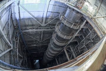 An astronomical telescope in a factory workshop.