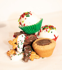Assorted holiday desserts with sprinkles in makeshift studio