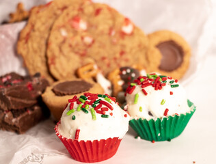 xmas colors assorted holiday desserts with festive truffle on white tissue paper