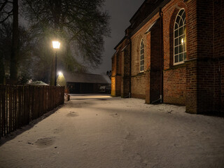 Church of Amerongen in the Winter with snow. Windows of the building