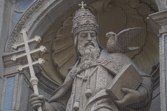 Close up of a statue of Pope Gregory I, Saint Gregory the Great, with his famous Catholic iconography of a dove sitting on his shoulder at St. Stephen's Basilica, Budapest, Hungary
