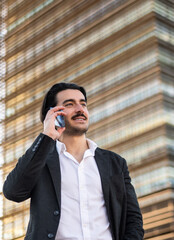 Focused Real Estate Agent Using Smartphone Against Modern Background, Representing Professionalism And Technology In Business World. 