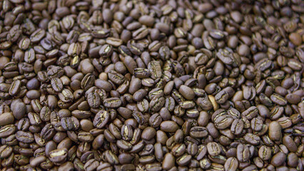 Roasted robusta coffee beans in close up view.