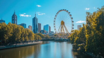 Urban landscape with Ferris wheel by river under blue sky