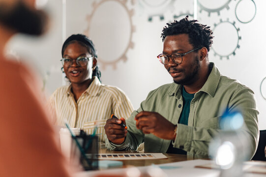 Designers working together on creative project in modern office