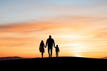 Fototapeta premium A family silhouette against a stunning sunset, showcasing togetherness and love. This peaceful scene captures a moment of joy and connection in nature.
