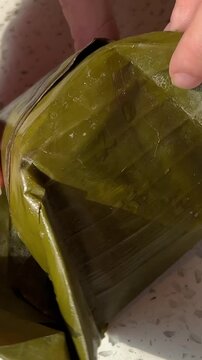 Palm Leaf Pie. Vietnamese food in palm leaf. Vietnamese street food, served in green palm leaves in Ba Be National Park.