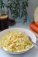 A bowl with coleslow salad