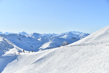 Skiers on the slopes of Courchevel ski resort,French alps.
