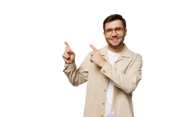 Young man in casual clothing gestures with both hands, showcasing enthusiasm in a bright setting