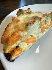 Delicious vegetable frittata slice with carrots and broccoli