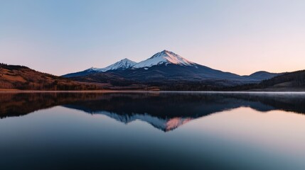 Twin snow-capped peaks reflect in a mirrored lake, framed by a gentle sunrise, evoking serenity.