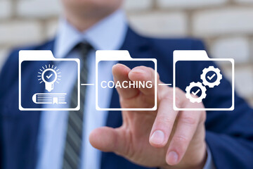 Coach person working on virtual touch screen clicks word: COACHING. Coaching Mentoring Development...