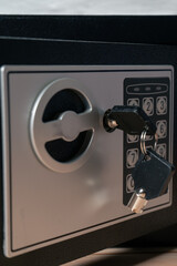 Safe or security box with key and digital keypad.