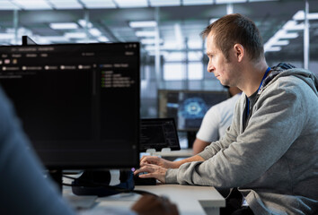 Man getting PC crash while trying to fix error in high tech data center workplace, solving tasks....