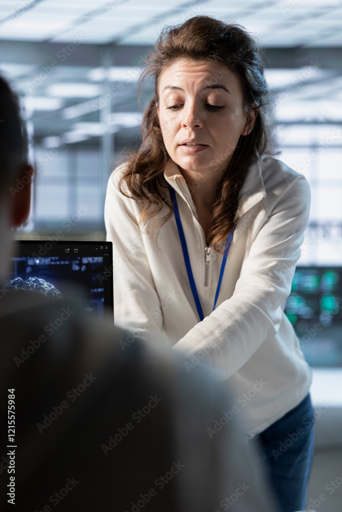 Poster manager overseeing workers in data center, coordinating deployment of server architecture, improving