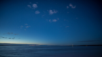 Blue night scenery over the frozen lake Näsijärvi in Tampere, Finland