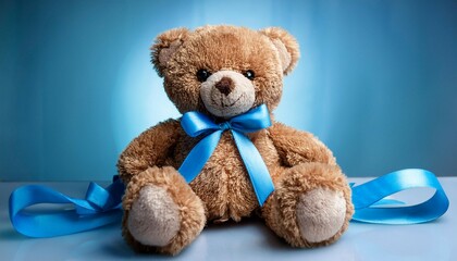 Obraz premium teddy bear with blue ribbon