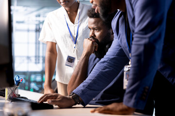 Team of data center program developers creating technical documentation for software applications....
