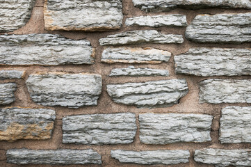 White Stone Mortared Into Red Wall