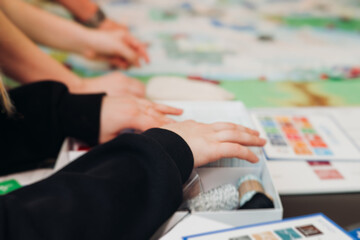 Process of playing tabletop board game on the table, fun with friends and family in room indoors, board game party concept, company group of students adults play board games, roll the dice on game map