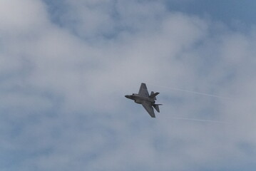 F35 doing stunts at air show and breaking sound barrier. Sonic boom