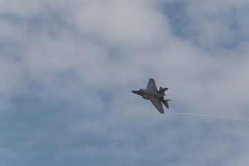 F35 doing stunts at air show and breaking sound barrier. Sonic boom