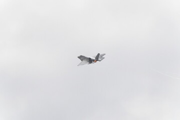 F35 doing stunts at air show and breaking sound barrier. Sonic boom