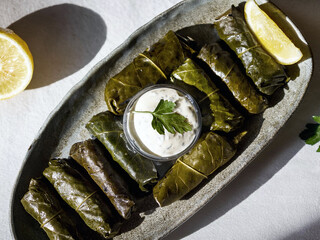 Dolmas, yaprak sarma. Grape leaves stuffed with rice and fresh herbs.	