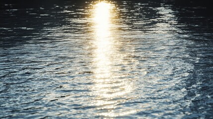Sunlight reflects off rippling water, radiating warmth and serenity, as gentle waves weave patterns across the tranquil surface.