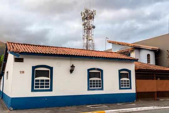 S&Atilde;O SEBASTI&Atilde;O, SP, BRAZIL - DECEMBER 12, 2024: Colonial style house with a telecommunications antenna tower in the historic city center.