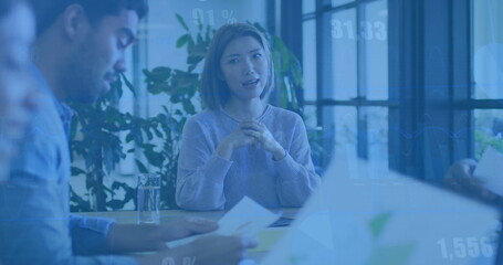 Image of financial data processing over diverse business people in office