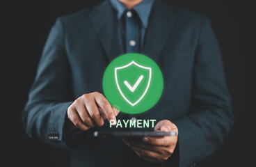 Mobile Payment Security Protection. businessman interacting with a virtual shield icon for secure...