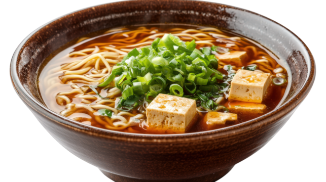 bowl of ramen. showcasing a rich broth with noodles. cubes of tofu. and topped with finely chopped green onions the dish is served in a traditional brown bowl. emphasizing its appetizing and comfortin