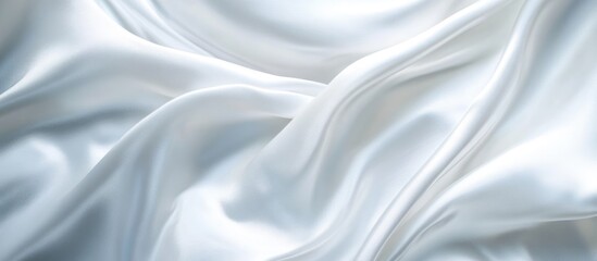 Obraz premium White satin fabric texture with flowing drapes and soft folds suitable for background applications Copy Space