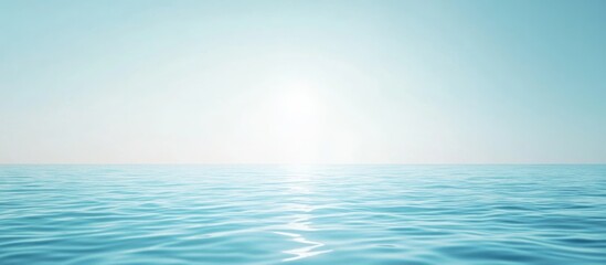 Fototapeta premium Calm ocean surface with gentle waves under bright sunlit sky in pastel blue tones Copy Space