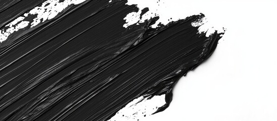 Black paint texture with brush strokes on white background ideal for background design and Copy Space