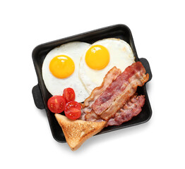 Pan with tasty fried eggs, tomatoes, toasts and bacon on white background. Top view