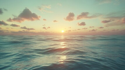 Obraz premium Serene sunset over calm ocean waters with soft clouds, creating a peaceful atmosphere at dusk