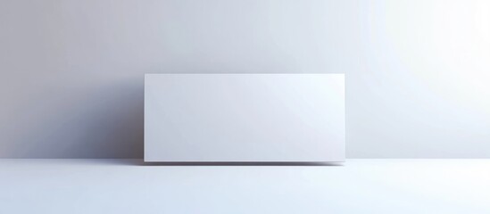Naklejka premium White rectangular box on a minimalistic background with copy space for text or graphic elements.