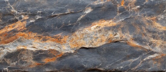 Natural textured stone surface with orange and gray patterns suitable for background use Copy Space