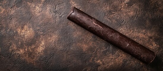 Brown textured surface with rolled leather or parchment and Copy Space for overlay text