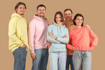 Obraz premium Group of young people in jeans on beige background
