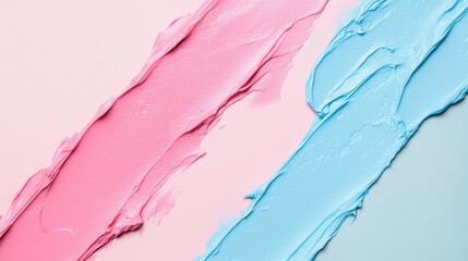 Cosmetic cream textures spread across pink and blue backgrounds, captured from an overhead perspective.
