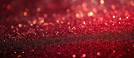 Red glittering abstract background for festive celebrations with shimmering effect and ample space for text or design elements.