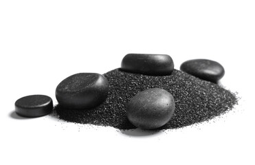 Heap of black beach sand with pebbles on white background