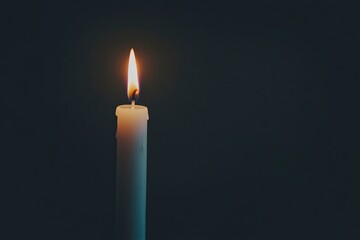 Single Burning Candle in Dark Background Peaceful Image