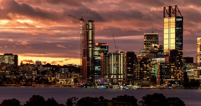 Dramatic Sunset lights reflect on Perth skyline with the Swan River in view